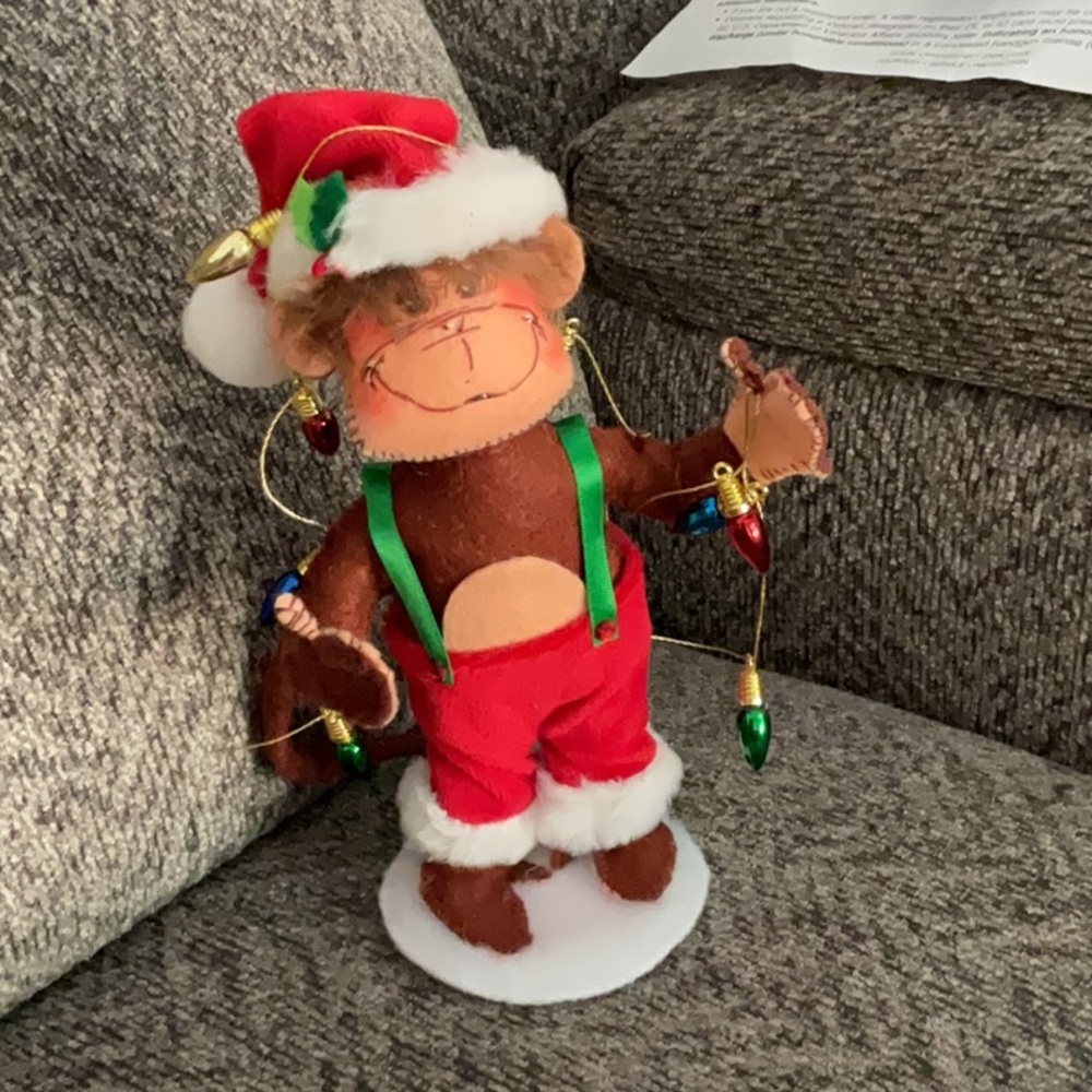 Annalee posable Christmas Monkey with Christmas light on circular stand